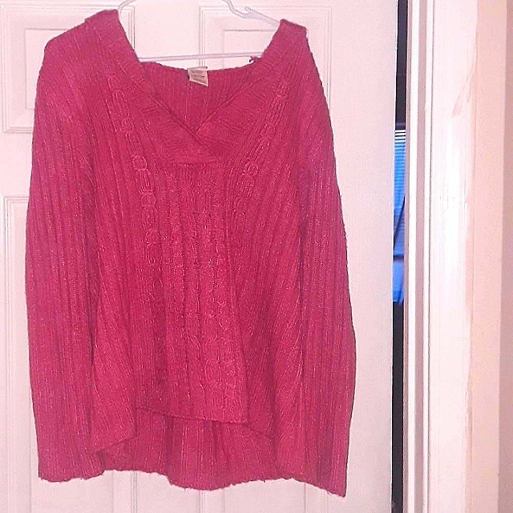 A knitted sweater with a hood